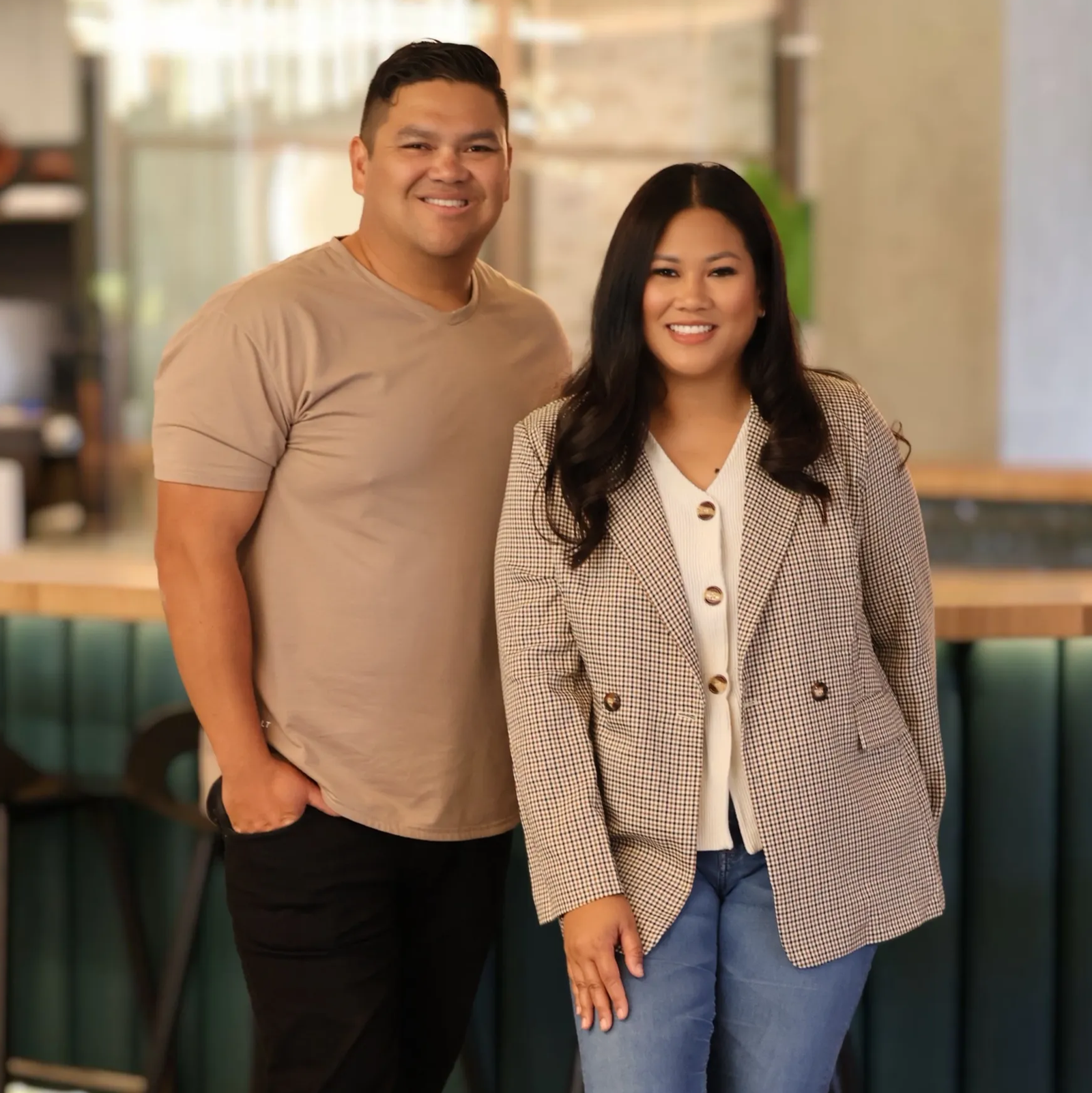 Fernando and Nicole, owners of SoCal Coverage Team, standing together