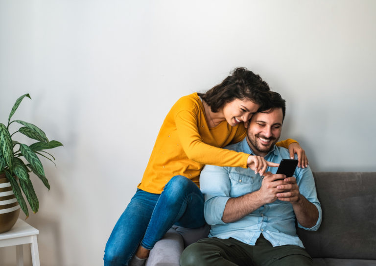 San Diego couple with a baby talking about life insurance at home