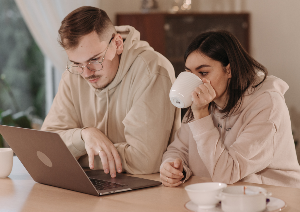 Couple reviewing their benefits paperwork together at a kitchen table